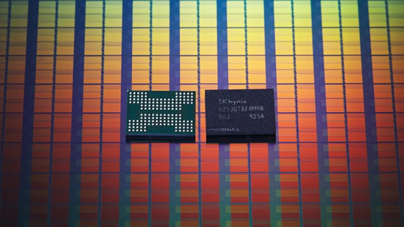 Two small SK hynix memory chips resting on a colorful, grid-patterned silicon wafer background with vertical rows in gradients of red, orange, yellow, green, and blue