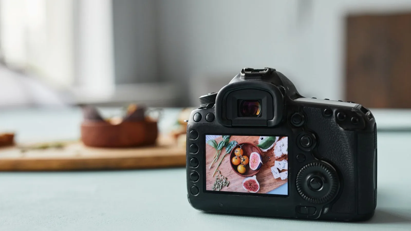 A close-up of a camera display screen showing a beautifully arranged plate of food, ready for a shot.
