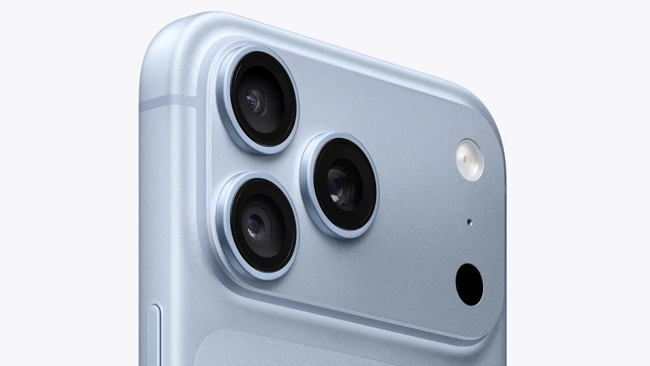 Close-up of a light blue smartphone's back showing three large camera lenses, a small flash, and an additional black sensor on a smooth, rounded-corner design