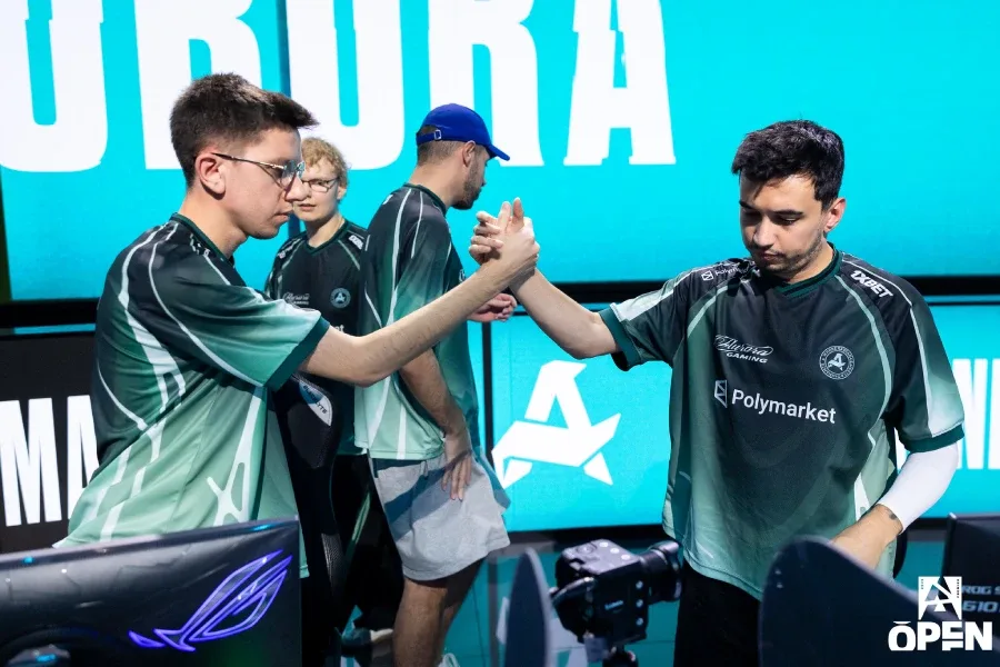 CS2 pro players from the team Aurora Gaming, greeting each other after a match at the esports tournament BLAST Open Fall 2026 — a photo.