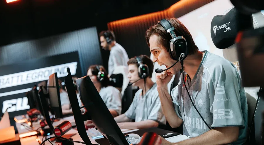 The photo features Counter-Strike pro players from Team Spirit: excited during a successful match at the CS2 Esports World Cup 2026 (EWC 2026).