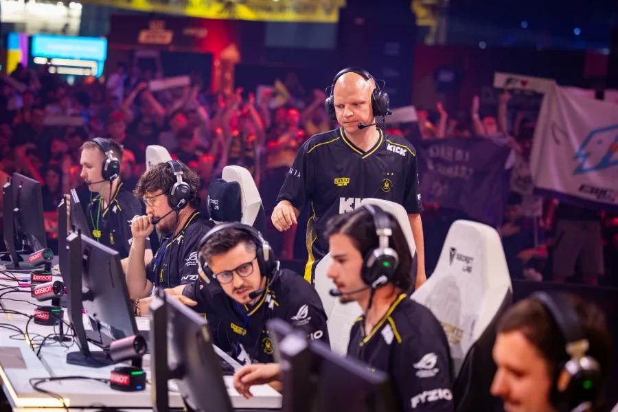 The photo features Counter-Strike pro players from Team Vitality: focused during a match at the CS2 Esports World Cup 2026 (EWC 2026), with a crowd in the background.