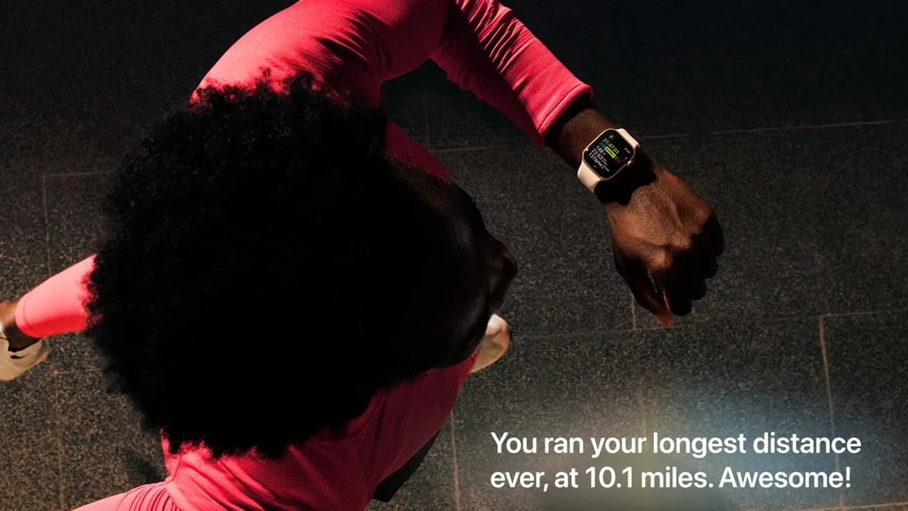 Runner in bright workout clothes checks smartwatch mid-stride, screen showing a congratulatory message for running 10.1 miles, with matching motivational text displayed in the lower right corner