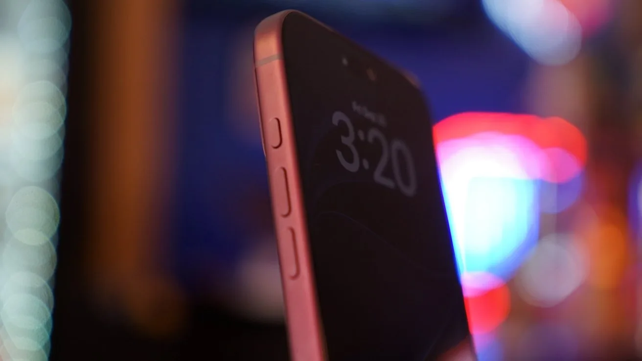 Close-up of an iPhone 18 Pro Max showing 3:20 on the screen, side buttons visible, with colorful blurred lights in the dark background
