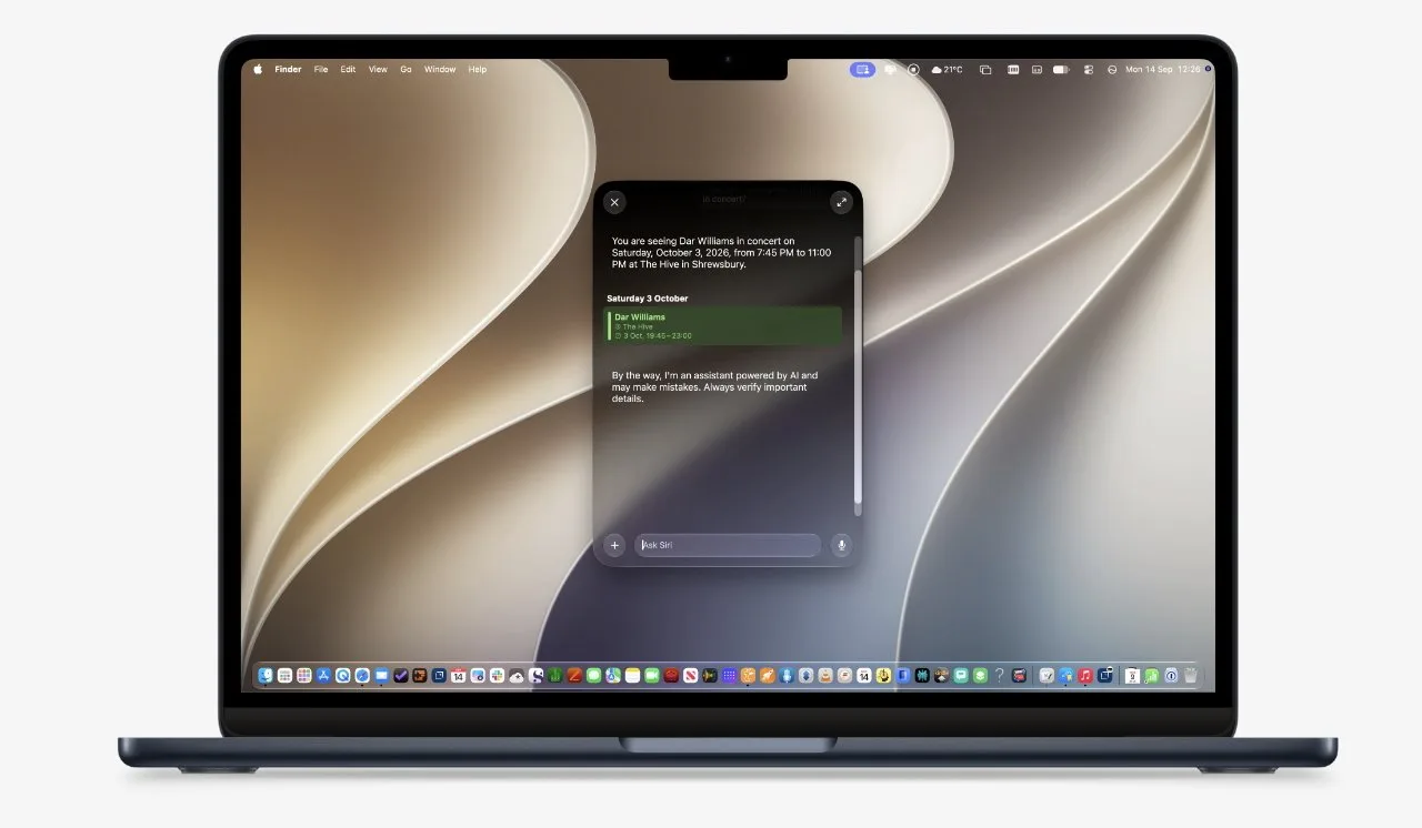 Open MacBook laptop displaying a colorful abstract wallpaper and a centered notification window, with app icons arranged along the bottom dock against a light gray background
