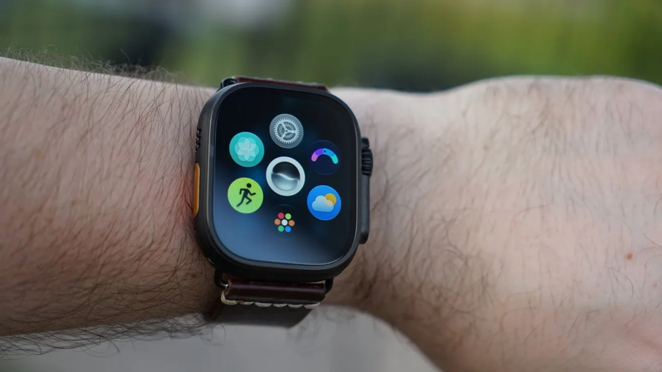 Apple Watch Ultra 4 with a black rectangular screen on a person's wrist, showing colorful circular app icons including fitness, weather, and activity rings, against a blurred outdoor background