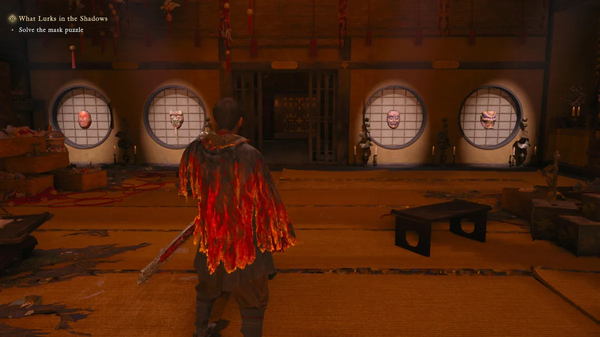 Musashi looking at the Mask puzzle by the entrance in Onimusha: Way of the Sword.