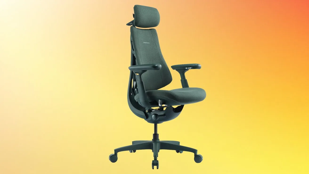 Ergonomic black office chair with headrest, adjustable armrests, and wheeled base, centered against a smooth gradient background shifting from soft orange to bright yellow