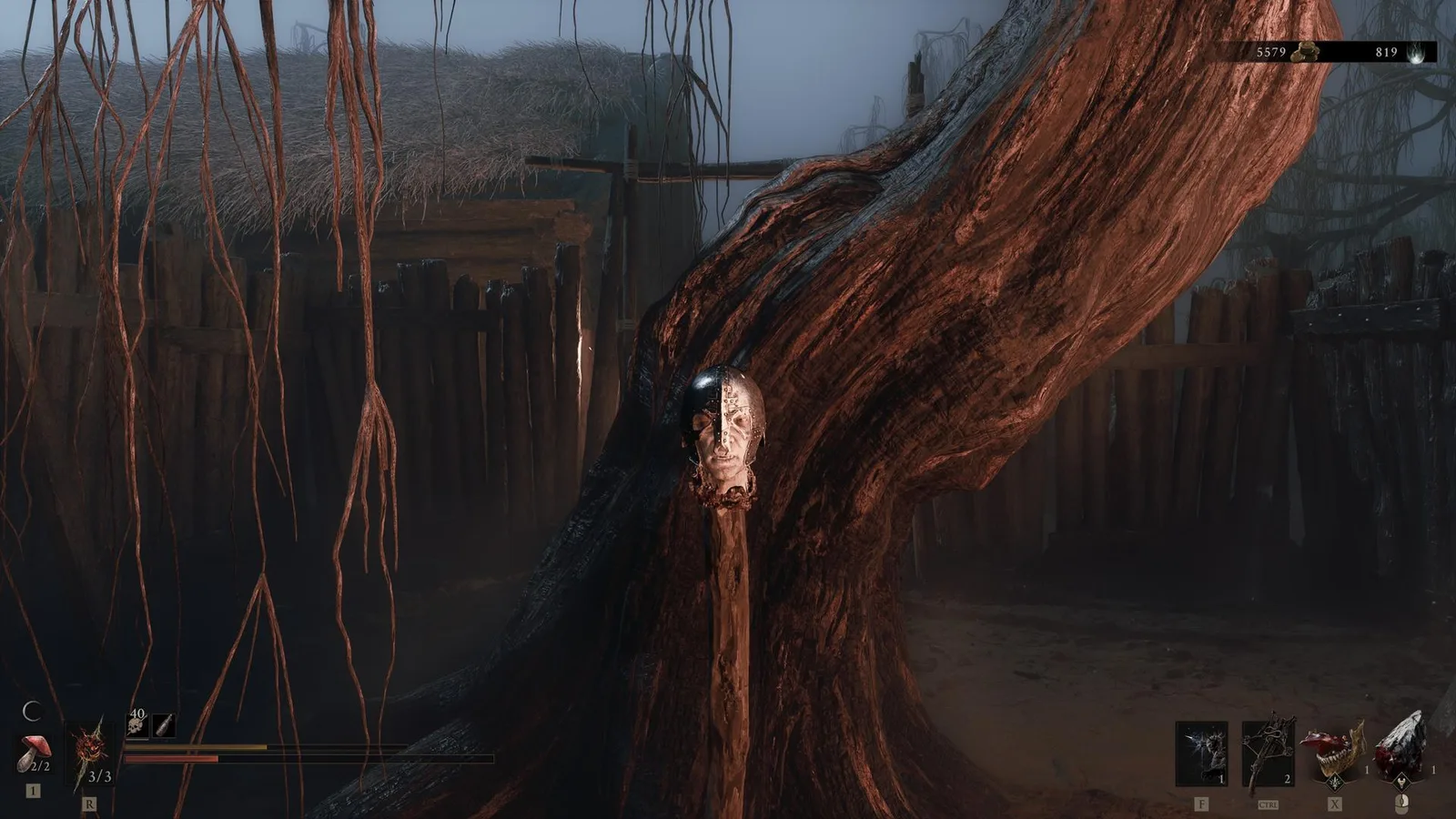 A soldier’s head affixed to a wooden spike in Mortal Shell 2.