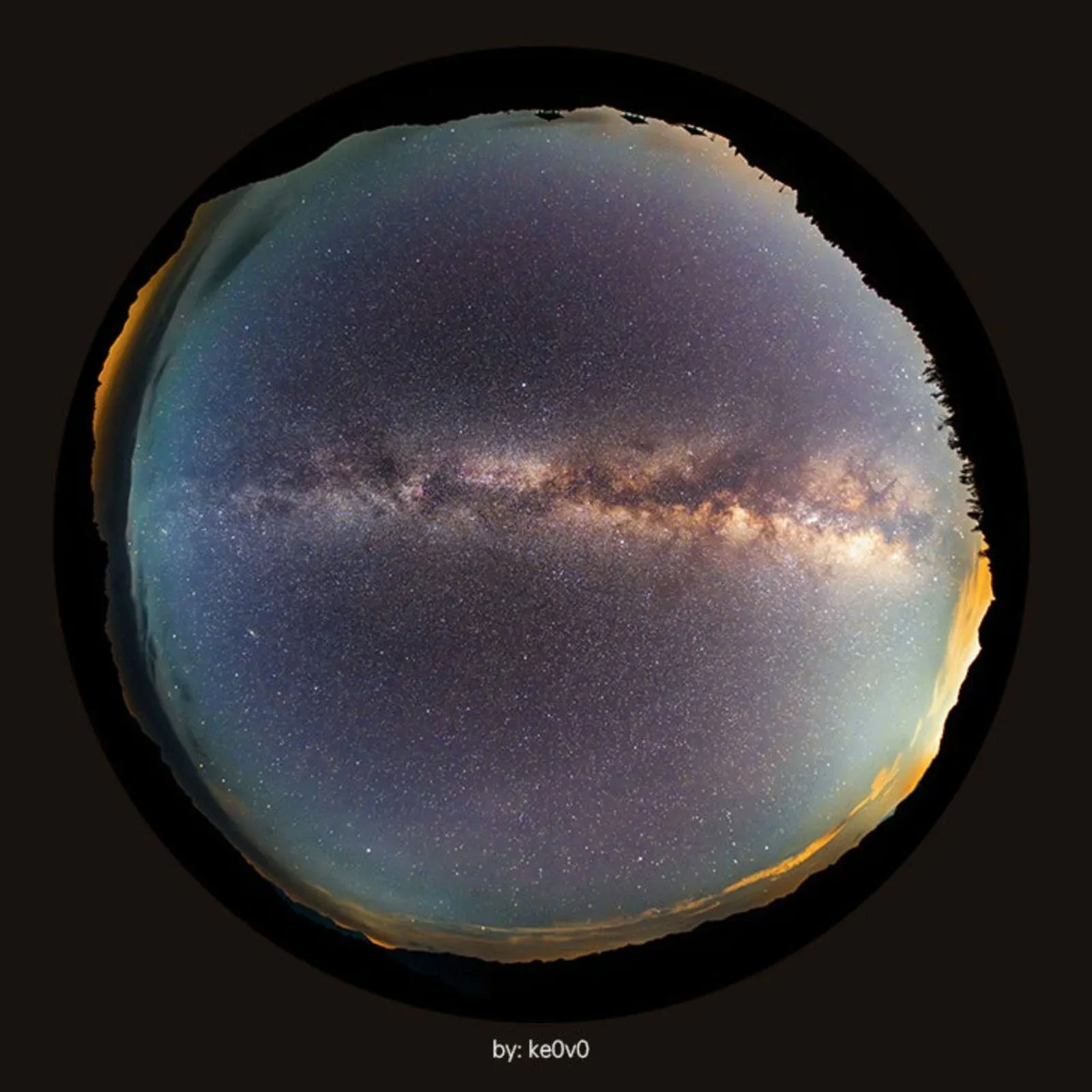 A circular fisheye view of the Milky Way galaxy stretching across a star-filled night sky above a dark horizon.