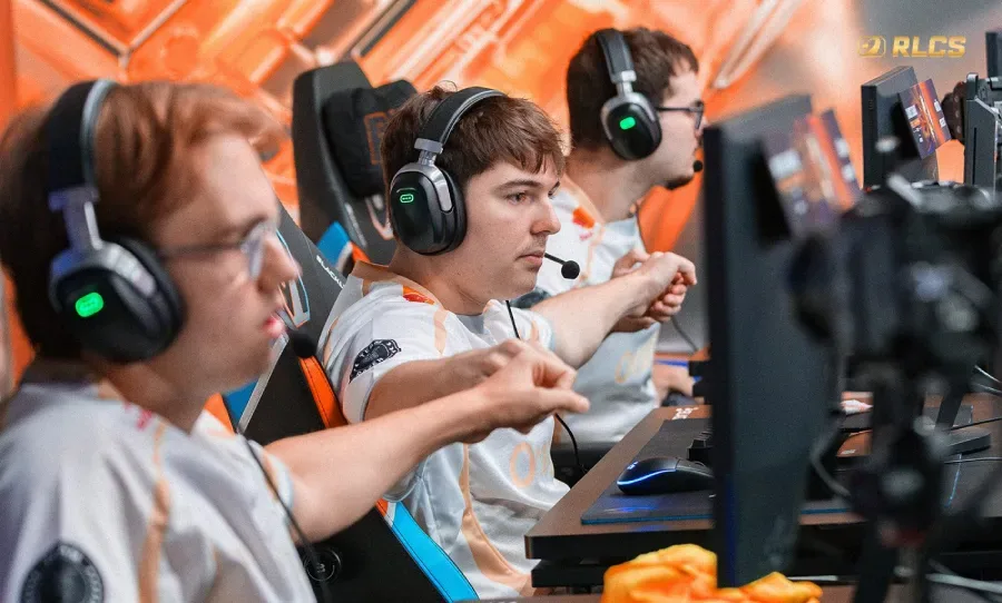It’s a photo of the pro Rocket League players from the team Karmine Corp: Focused during a match at the RLCS 2026 World Finals.